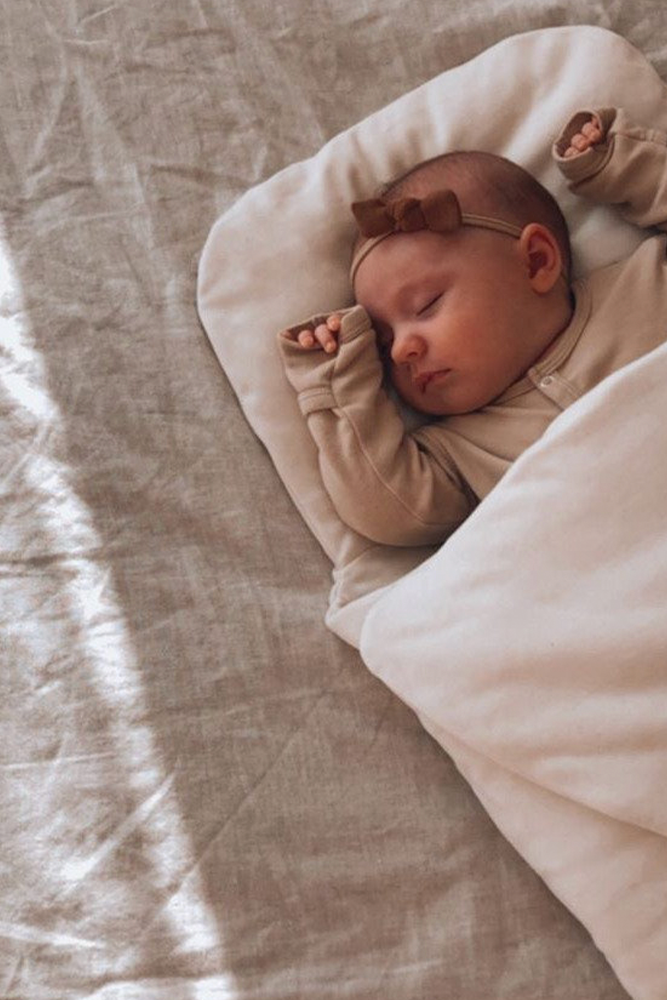 Baby sleeping in Bundl wool wrap