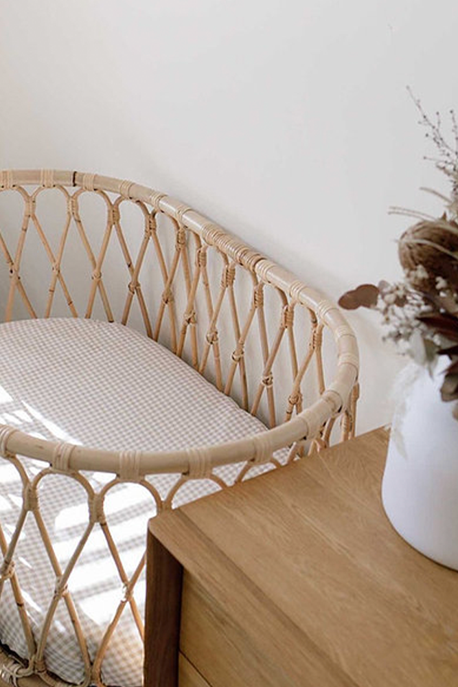 rattan cane bassinet with gingham fitted sheet